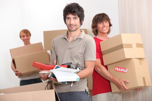 Family organizing boxes for mobile self storage in Richmonduponthames