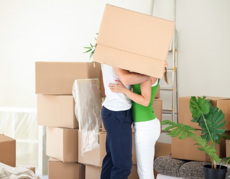 Packed moving boxes and furniture ready for removals in Richmonduponthames
