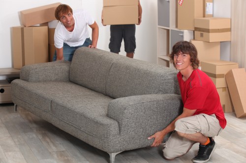 Professional removals team handling furniture during a house move in Richmond upon Thames